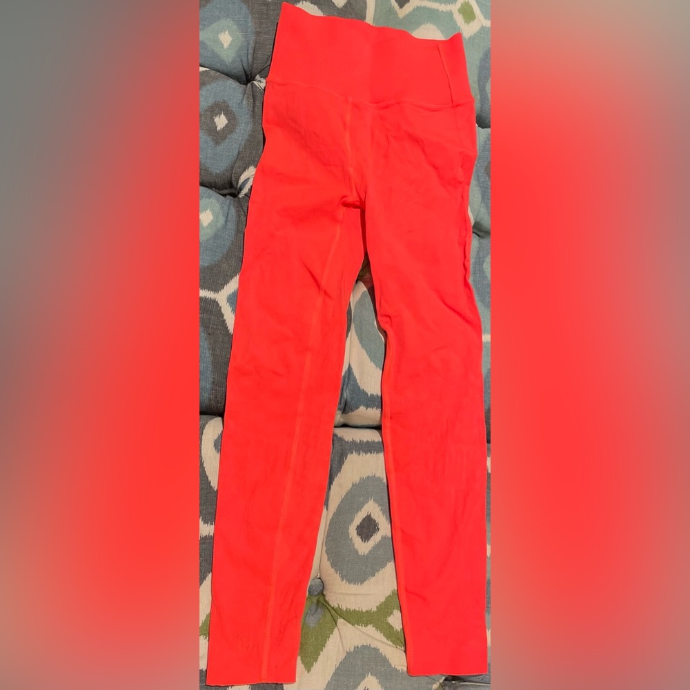 Fabletics Sculptknit neon coral ankle leggings.